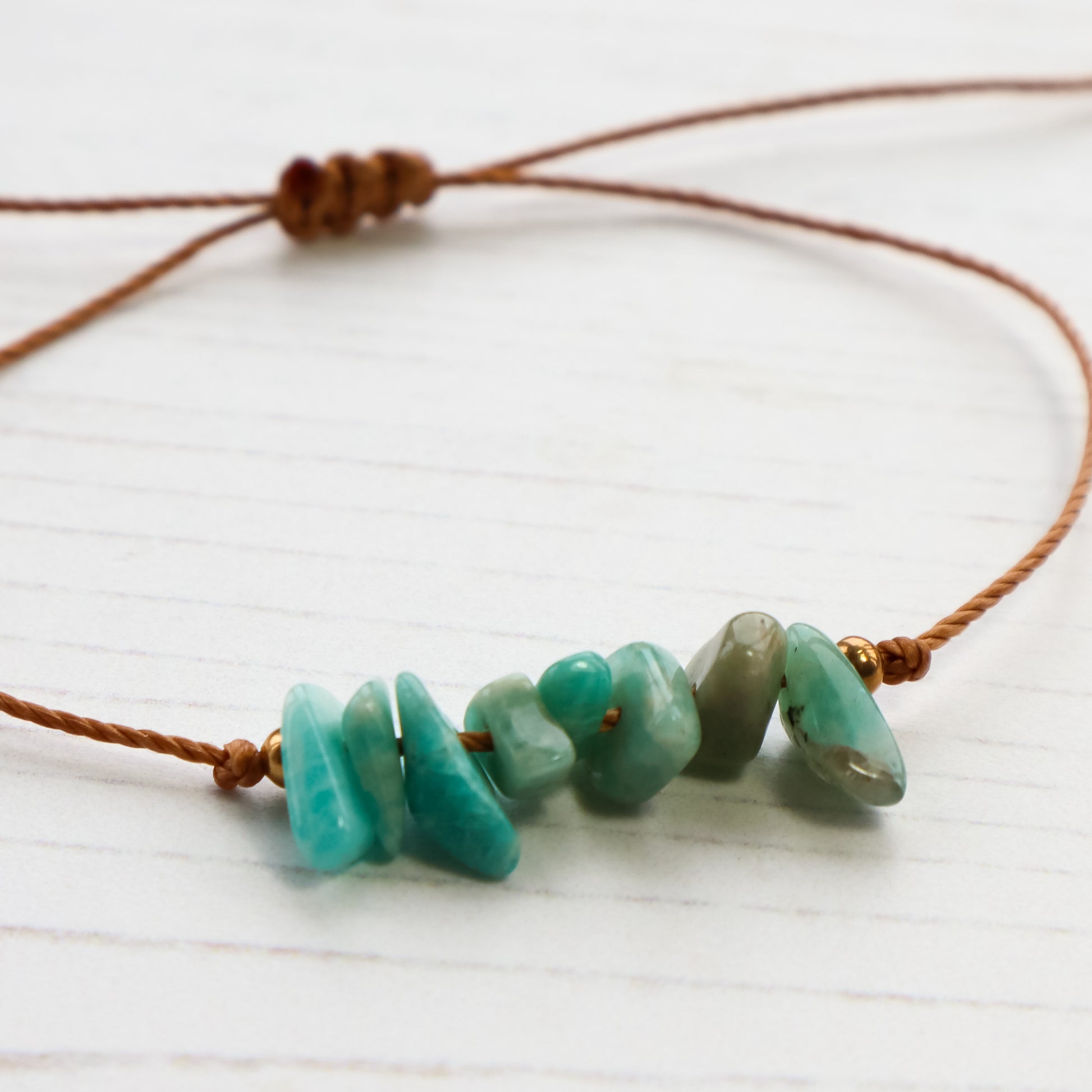 Bracelet with turquoise beads on a white background