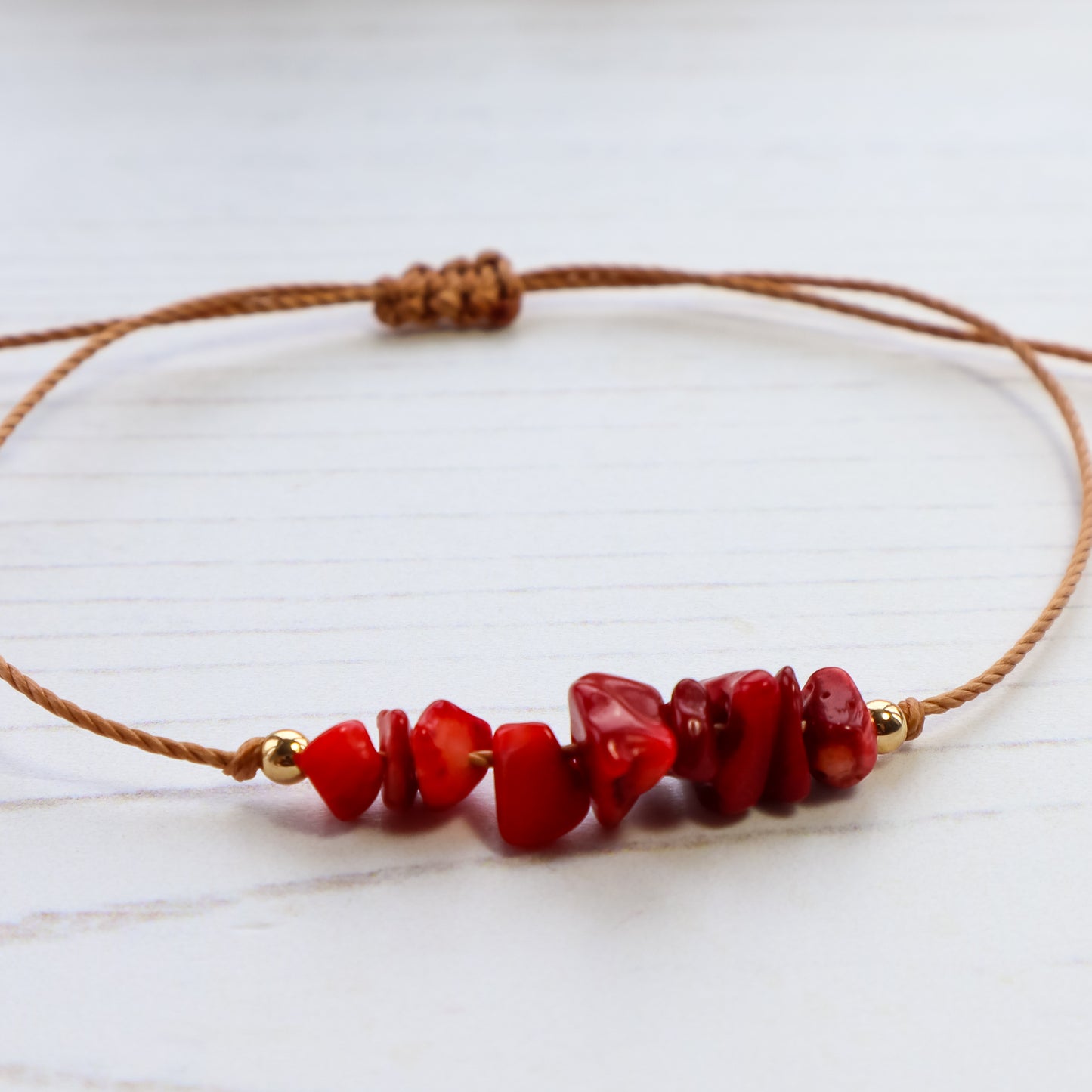 close up of bracelet with red crystal beads